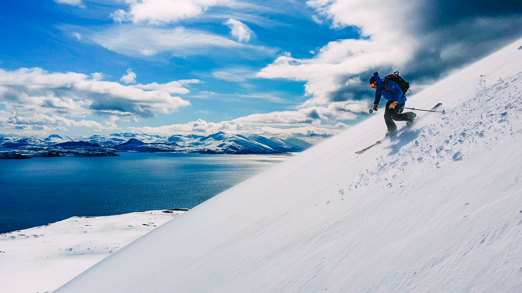 One person skiing down a mountain