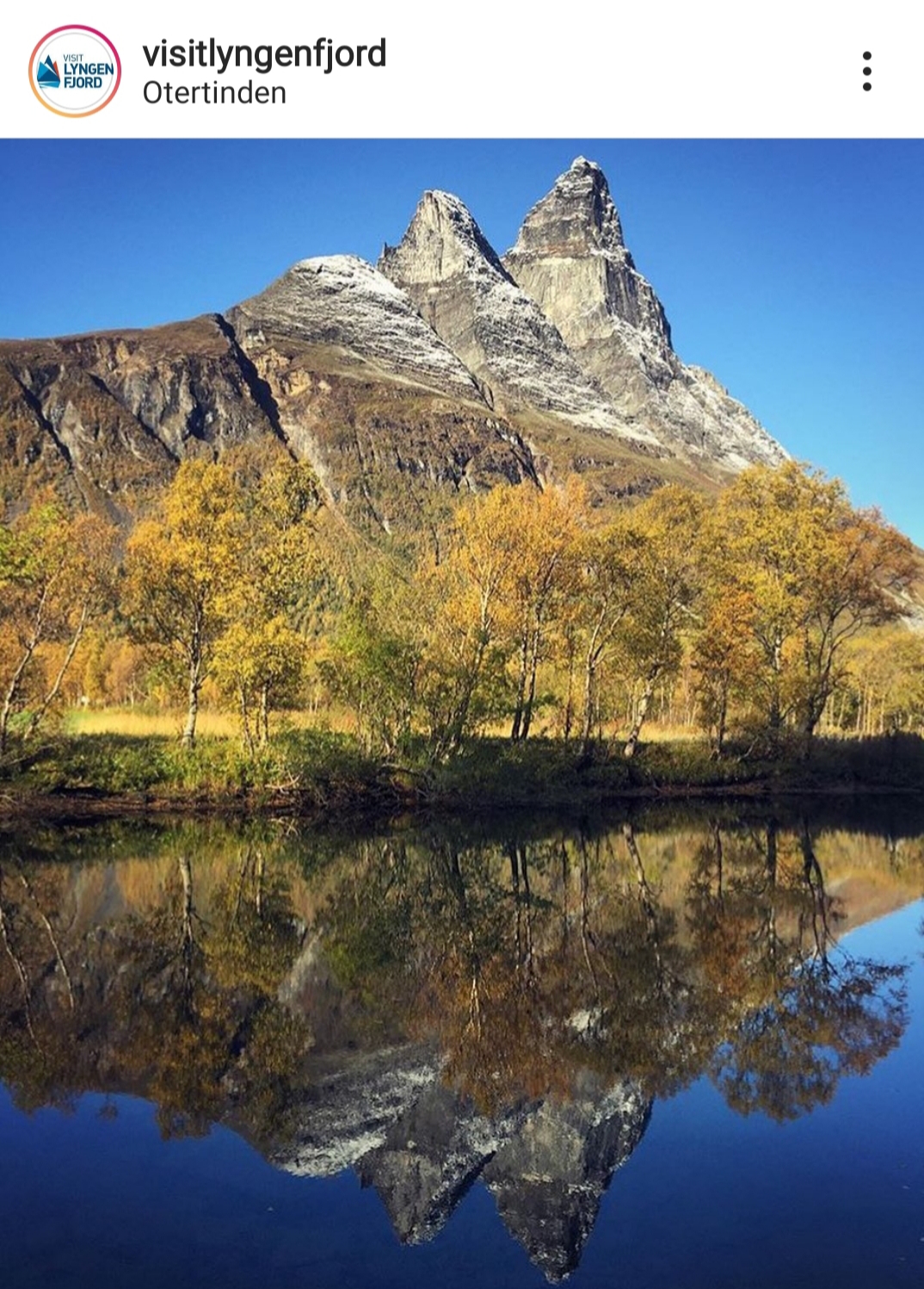 Utrsikt mot Otertind som speiler seg i vannet i Signaldalen i Lyngenfjord