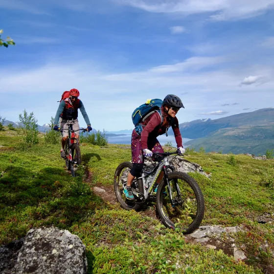 Two cyclist on a trail by the Lyngenfjord