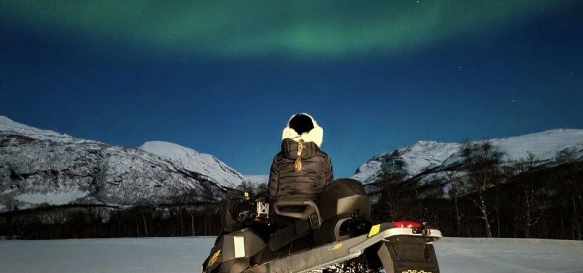 Northern lights safari on snowmobile