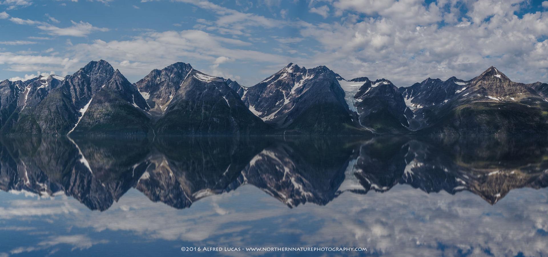 The Lyngen Alps mirroring in the Lyngenfjord