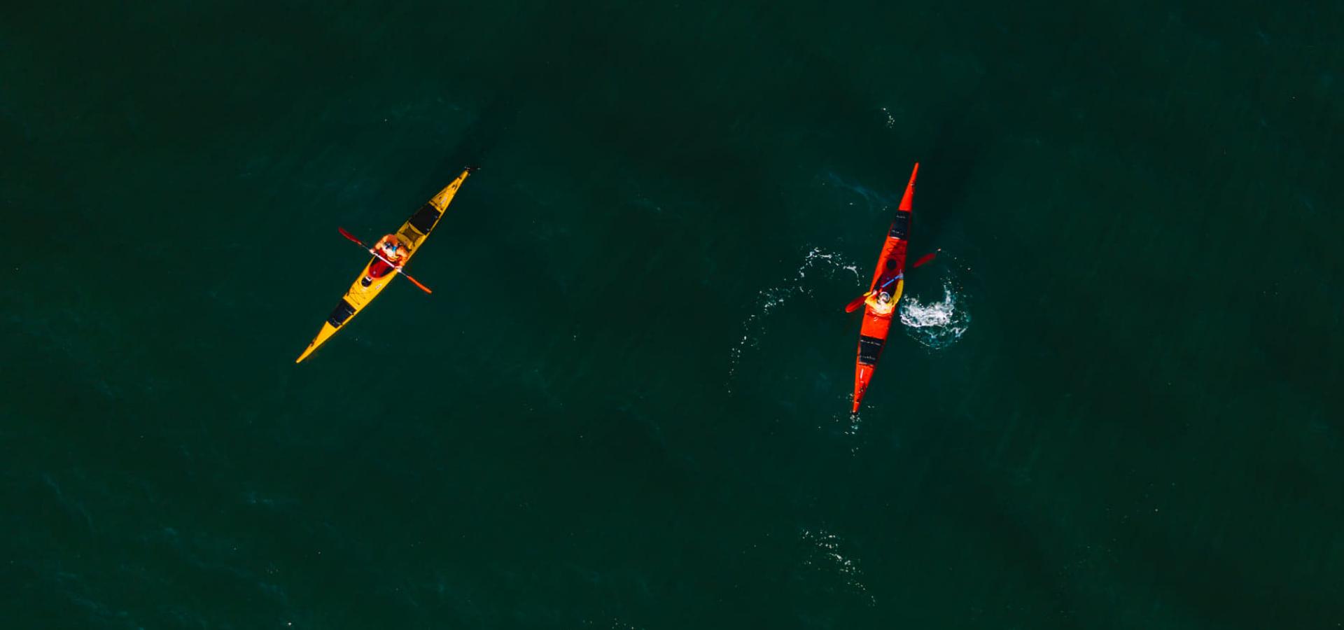 Two kayaks on the fjord, birdseye view
