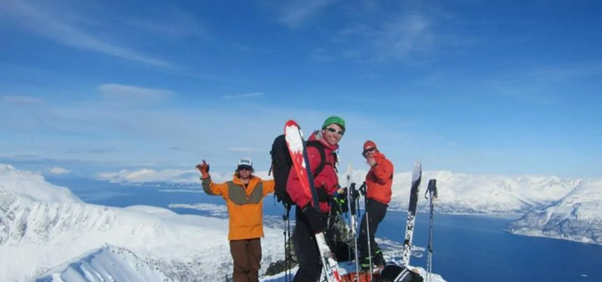 skiers on top of mountain