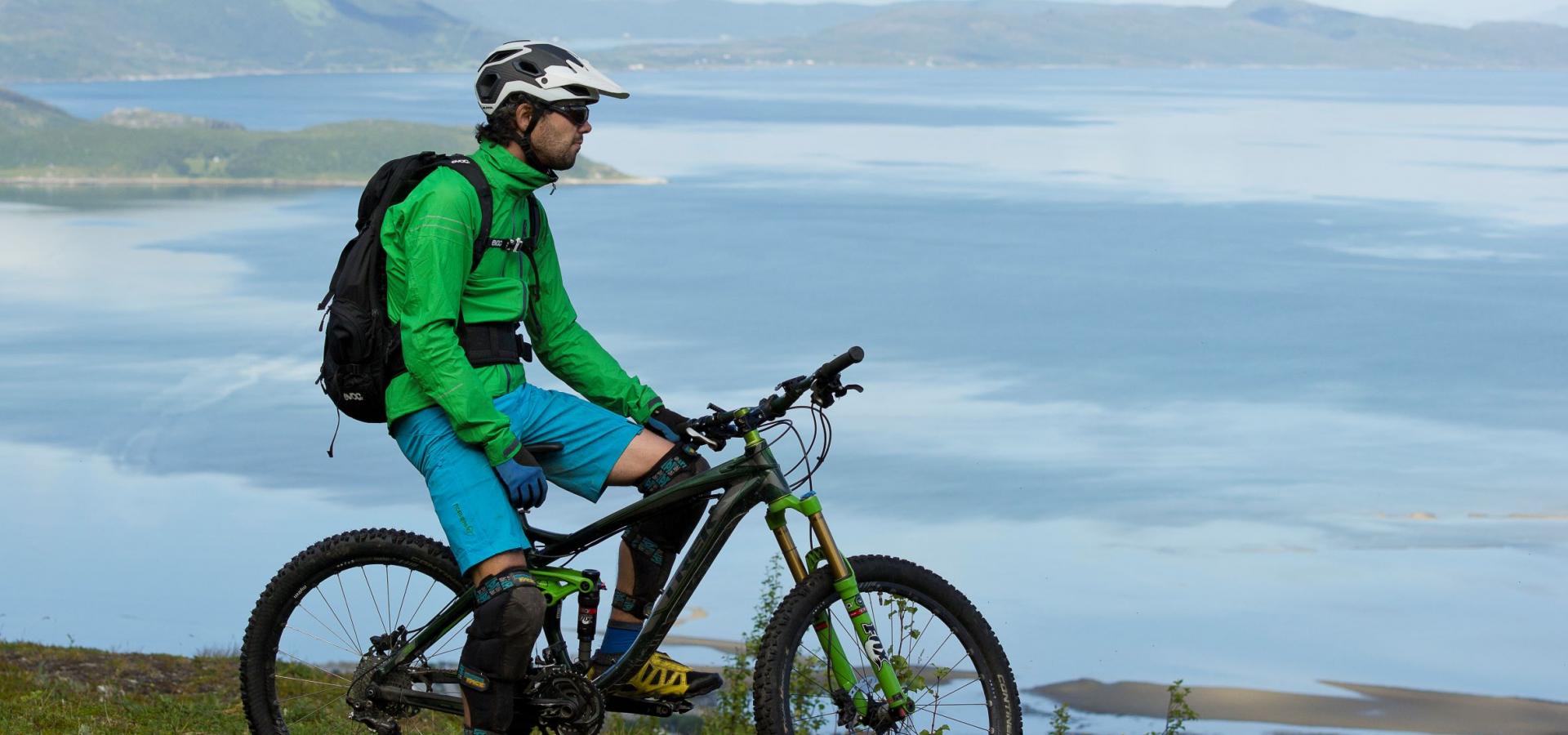 Mountain biker enjoying the view of the fjord