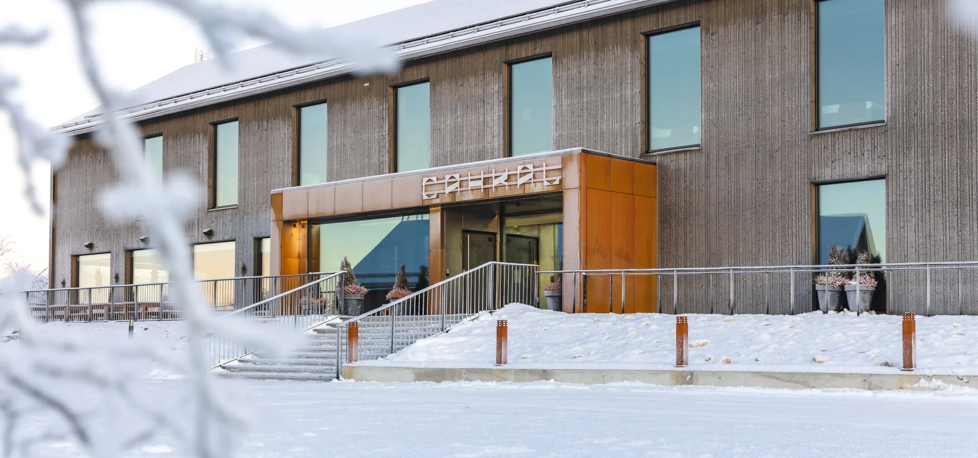 Entrance of Cahkal Hotel with clear snow in front of the hotel