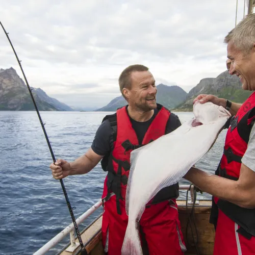 Two fishers caught a halibut