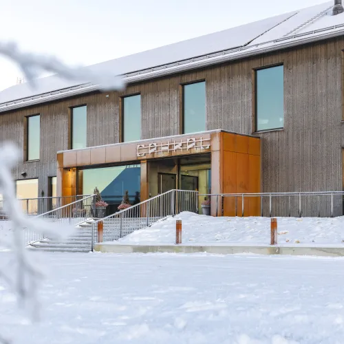 Entrance of Cahkal Hotel with clear snow in front of the hotel