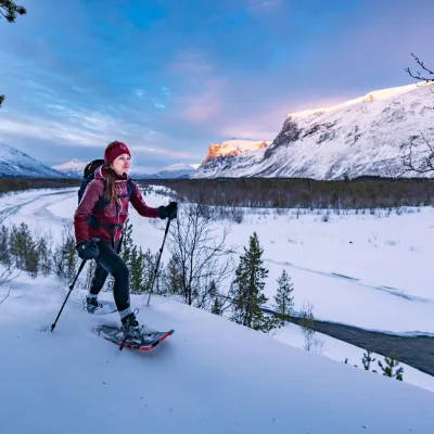 One woman snowshoeing