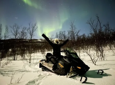 Northern lights safari on snowmobile