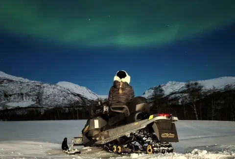 Northern lights safari on snowmobile