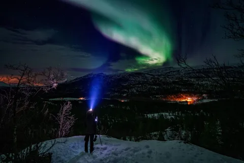 Snowshoeing aurora borealis