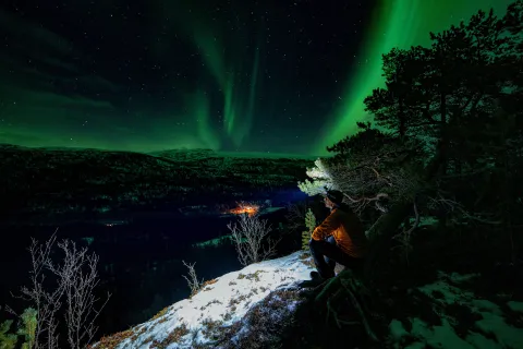 Snowshoeing aurora borealis