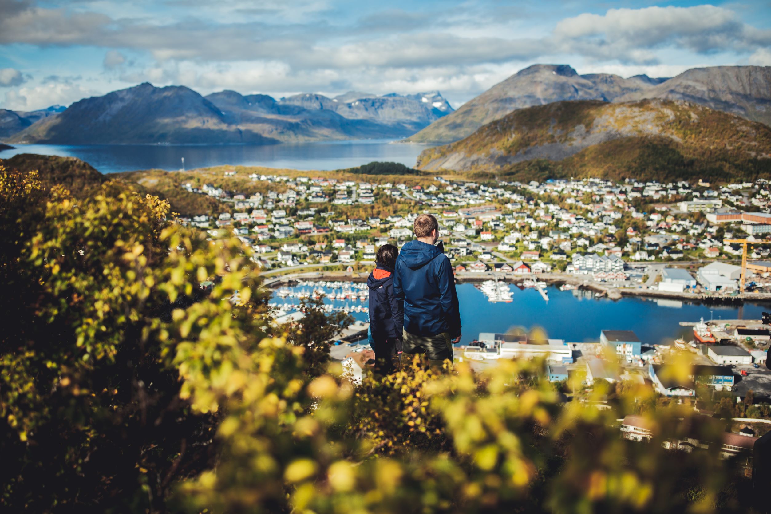 Two people enjoying the autumn view from Stussnesfjellet in Skjervøy, Northern Norway